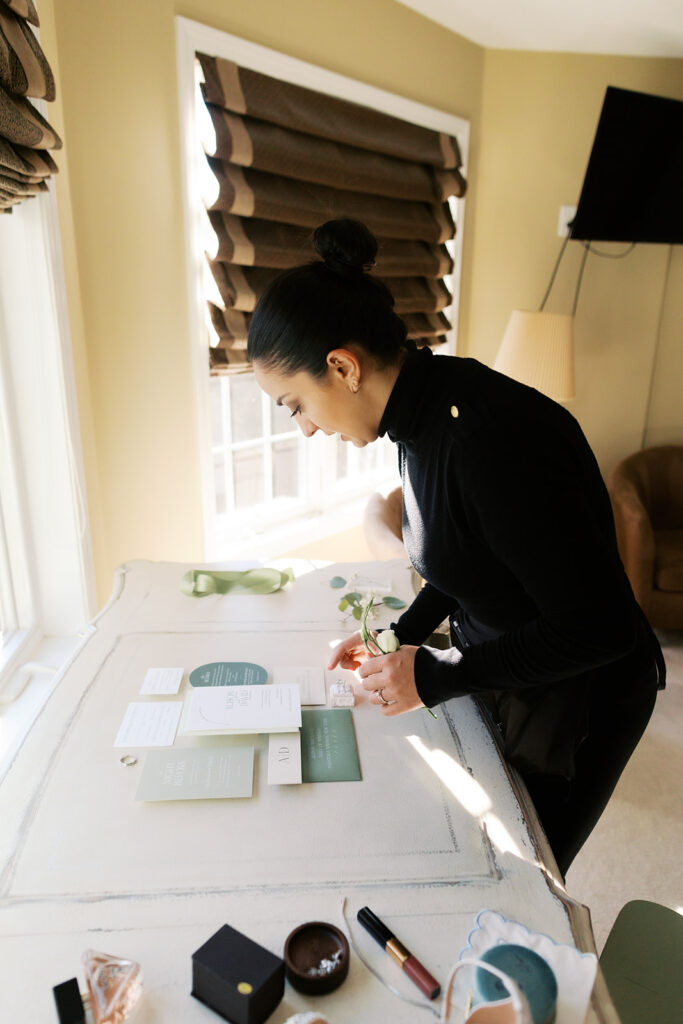 Do You Need A Wedding Planner? Luxury Wedding Planner kelly Jeanmaire setting up a flat lay in the morning of a wedding