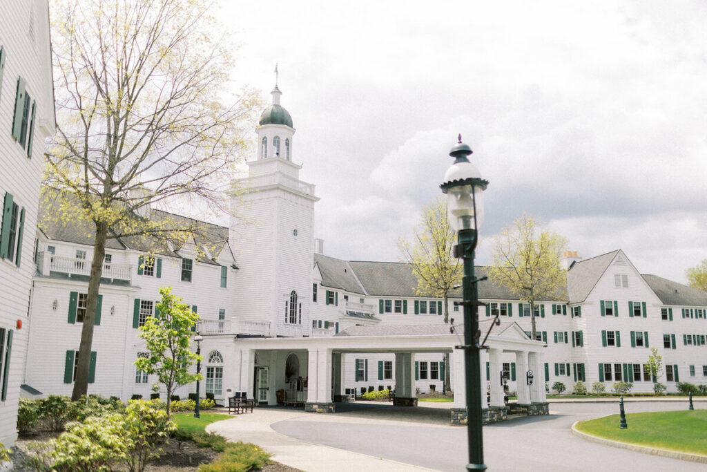 Historic estate wedding venue of the Sagamore Resort with green shutters in Hudson Valley, New York.